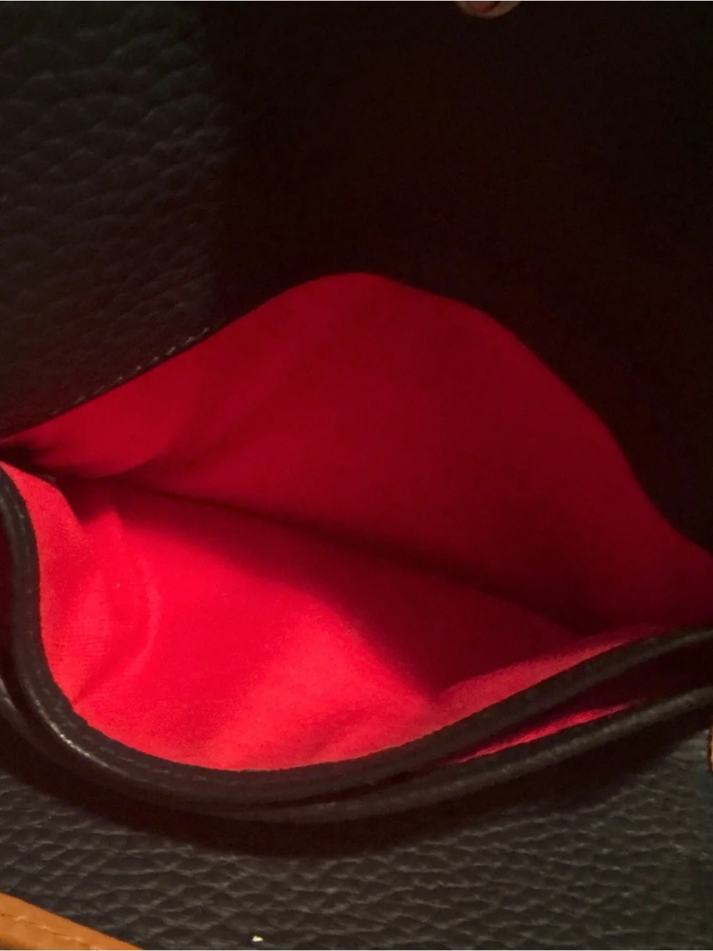 3 1/2”. X. 7”.  pebble-grain leather Dooney & Bourke Continental Clutch